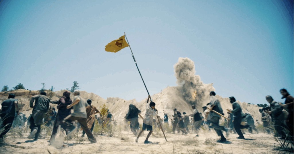 Child raising Superman flag